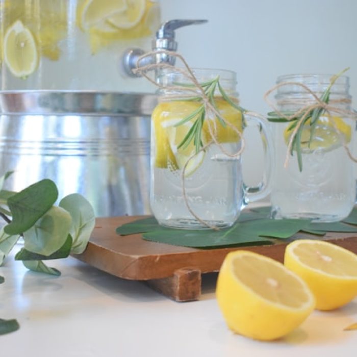 Jar of water with lemons.