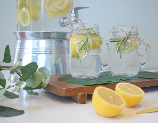 Jar of water with lemons.