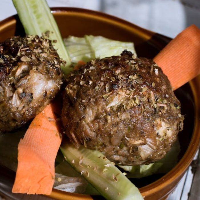 Bowl with meatballs and vegetables.